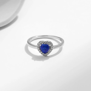 Elegant S925 sterling silver ring featuring a blue heart-shaped opal and zircon halo