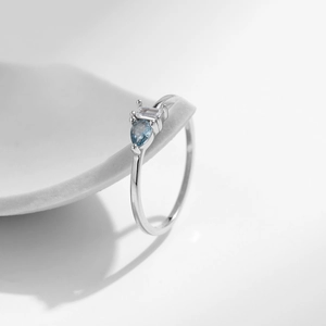 S925 sterling silver geometric ring featuring a pear-shaped blue diamond and zircon