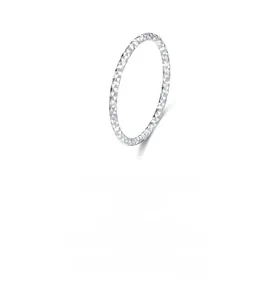 Detail of S925 sterling silver ring with textured diamond-cut facets on white background