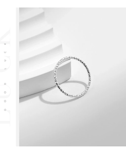 Detailed view of S925 sterling silver ring with textured sparkling diamond-cut finish
