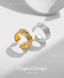 Detail of irregular texture and S925 sterling silver hallmark on wide open rings