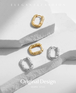 Close-up of S925 sterling silver earrings with crushed foil texture in gold and silver