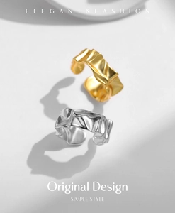 Macro shot of S925 sterling silver rings with irregular crinkle texture in gold and silver