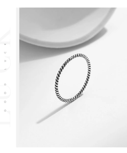 Close-up of a vintage twisted s925 sterling silver ring with distressed texture finish
