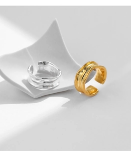 Detail view of silver and gold irregular textured S925 sterling silver open rings