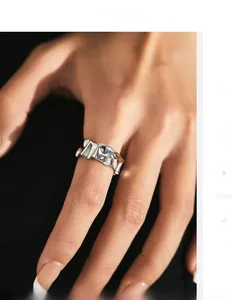 Close-up detail of silver irregular pleated texture on minimalist open ring for women