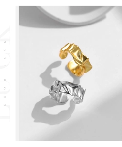 Detail of irregular pleated texture on S925 silver open rings in gold and silver