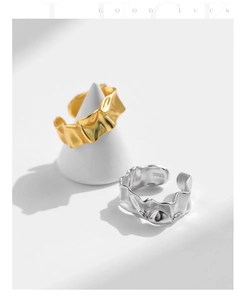 Detail of S925 sterling silver rings with irregular wrinkled texture and gold finish