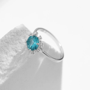 Elegant S925 silver sunflower ring with blue round gemstone and halo diamonds