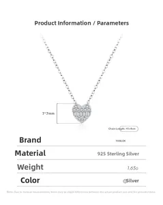 Macro detail of 925 sterling silver heart necklace with step-cut and round diamond setting