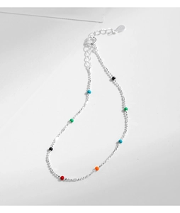 Macro detail of S925 sterling silver chain featuring colorful enamel beads and 925 heart tag
