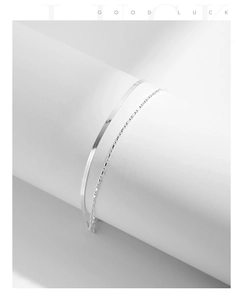 Close-up of dual-layer S925 silver bracelet featuring a flat snake chain and beaded link