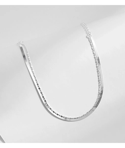 Close-up of double-layer S925 silver snake chain and bead necklace with lobster clasp