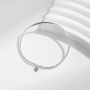 Elegante bracciale in argento sterling S925 con perline, tubo curvo e ciondolo a cuore