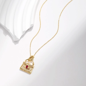 S925 sterling silver gold necklace with a red pear-shaped stone handbag pendant