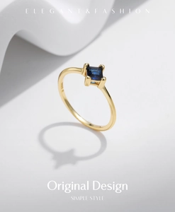 Detailed close-up of a S925 silver gold-plated ring featuring a square blue gemstone