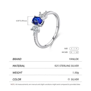 Vintage s925 silver ring featuring an oval blue sapphire and marquise white cubic zirconia