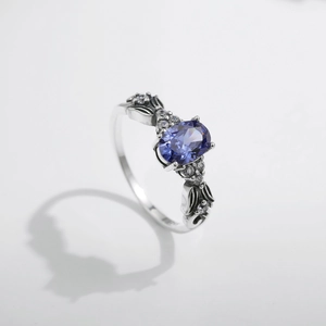 Vintage s925 silver mermaid tail ring featuring an oval purple gemstone and accent diamonds