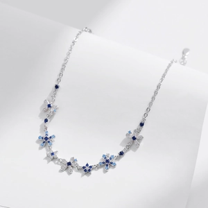 Elegant S925 sterling silver floral necklace with blue and white gradient zircons