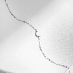 Polished S925 sterling silver moon pendant bracelet with sleek minimalist crescent design