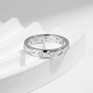 Irregular S925 sterling silver geometric ring with mixed-cut zirconia on stone pedestal