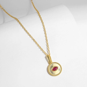 French vintage s925 silver necklace with red crystal on white minimalist backdrop