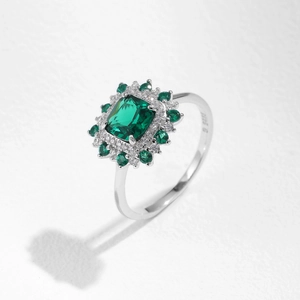 Vintage s925 silver ring with emerald-cut green stone and sparkling halo pavé setting