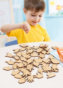 Macro detail of wooden hand gesture counting puzzles for early childhood math learning