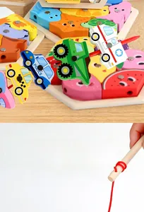 Detail of wooden hexagonal puzzle board featuring 3D magnetic fishing pieces for kids
