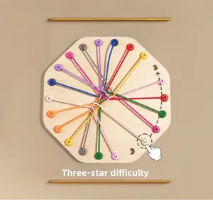 Detail of wooden logic puzzle board with colorful elastic ropes showing 3-star difficulty level