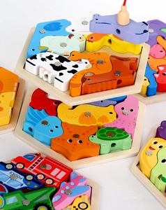 Macro view of wooden magnetic fishing puzzle pieces with farm animals and vehicles