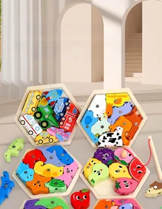 Close-up of magnetic wooden fishing puzzle with hexagonal trays and colorful animal pieces