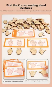 Macro detail of wooden hand gesture blocks and educational guide cards for child learning