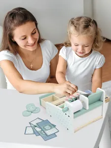 Detail of wooden cash register toy set with scanner, wooden coins and play money