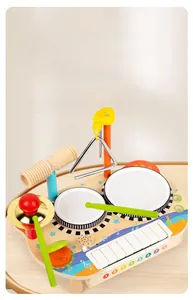 Detail of wooden musical toy set featuring xylophone keys and mini drum instruments