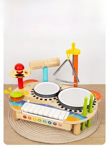 Detailed close-up of a wooden musical activity center featuring xylophone and drums