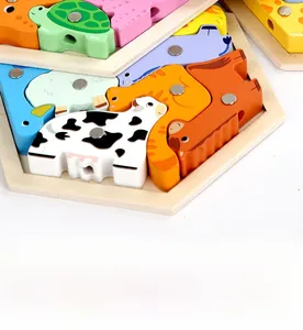 Detail of wooden magnetic fishing puzzle with colorful animal shapes and metal suction points