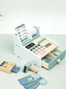 Detail of wooden play cash register set with scanner, credit card and play money accessories