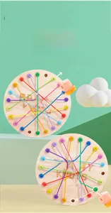 Detailed view of colorful elastic cords interlaced on a natural wooden game board