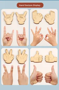 Close-up of wooden hand gesture puzzles showing rock, OK, scissors and like signs