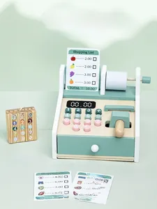 Macro view of wooden toy cash register with scanner and credit card accessory