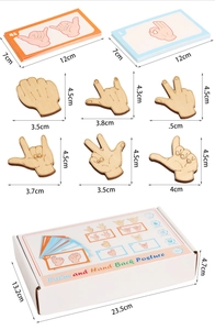 Detailed view of wooden hand gesture puzzle pieces with dimensions and storage box