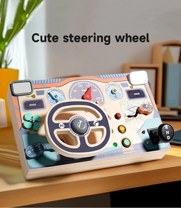 Detail view of wooden busy board with steering wheel and gear shift for fine motor skills