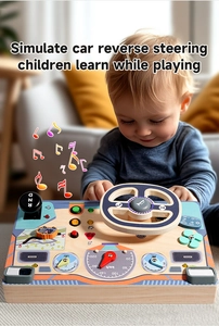 Close-up of a child playing with a wooden Montessori driving simulator busy board toy