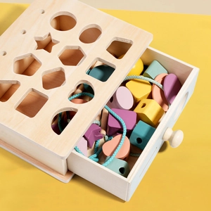 Wooden shape sorter box with colorful geometric blocks for toddler early learning