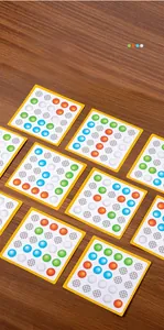 Detail of logic game cards with 4x4 color grids for kids' cognitive training