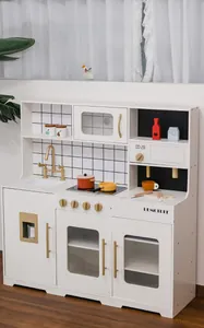 Detail of wooden play kitchen with white cabinets, golden handles, and a sink