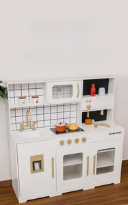 Detail of wooden play kitchen featuring a realistic microwave oven and golden handles