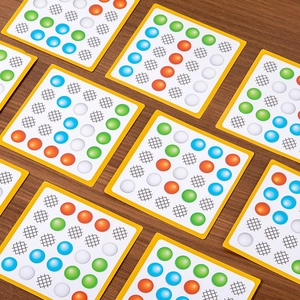 Educational logic thinking card set for kids with colorful pattern grids on wood background