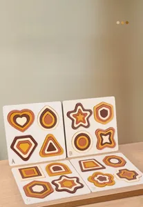 Detail of four wooden geometric 3D puzzles for kids in earthy neutral tones